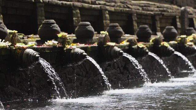Fountains and sacred pools in the temple Tirta Empul. Bali, Ubud.