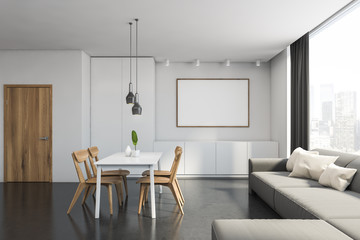 White dining room interior with sofa and poster