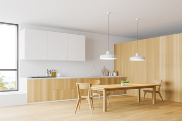 Wooden and white kitchen corner, dining table