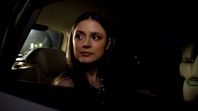 Beautiful Female Riding Auto To Party, Looking Through Car Window, Nightlife