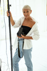 Attractive blonde female person working in studio