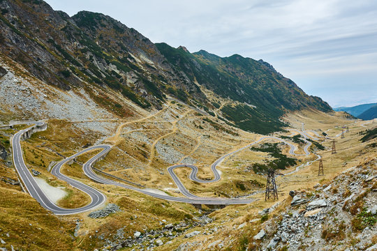 View of Transfagarash highway and valley in mountains of Romania. Tourist view mountain road. Autumn mountain landscape.