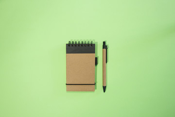 Brown notebook in green background