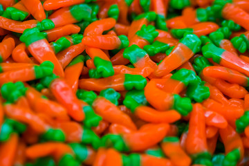 Background - assortment of delicious marmalade jelly candies for sale on counter of shop, grocery, market, cafe. Dessert, copy space, sweet food, pattern and confectionery concept