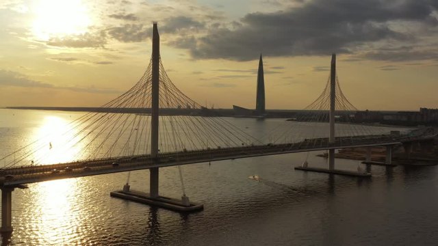 Aerial view of cable-stayed bridge and new skyscraper in St.Petersburg during sunset, 4k