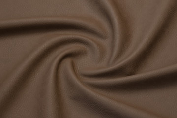 Fototapeta premium beige artificial leather with waves and folds on PVC base