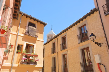 Fototapeta na wymiar Old building cityscape with flower pot Segovia Spain