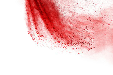 Red powder explosion on white background. Colored cloud. Colorful dust explode. Paint Holi.