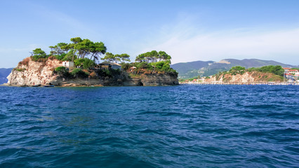 Naklejka premium Zakynthos Island, Greece - September 11, 2019: Cameo Island is available through a picturesque wood bridge in the port of Agios Sostis, next to Laganas Resort. Beauty of nature concept background 