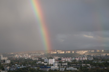 Rainbow after rain over the city