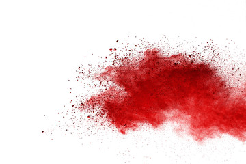 Red powder explosion on white background. Colored cloud. Colorful dust explode. Paint Holi.