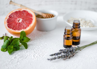 DIY cosmetics and spa. ingridients for homemade beauty facial mask. essential oil, mint, aloe, honey, milk, lavender, rosehip, oatmeal, coffee beans and grapefruit.
