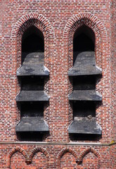 Gothic abat-son arches on the brick facade at the bell tower in Oevel, Belgium
