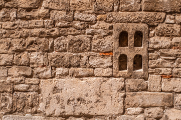 Fototapeta na wymiar Stone wall texture wih window. Closeup