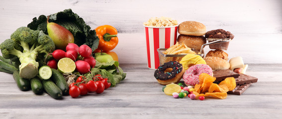 healthy or unhealthy food. Concept photo of healthy and unhealthy food. Fruits and vegetables vs donuts and fast food