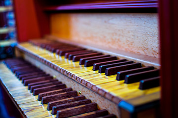 Fototapeta na wymiar Colorfull aged piano wooden