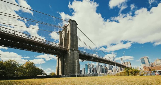 Brooklyn bridge during sunset over Manhattan with Cityscape of New York, USA. 4K time lapse