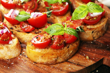 fresh tomato bruschetta. italian food appetizer with basil on table