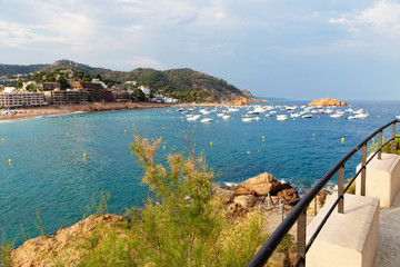 Naklejka premium View of the bay of Tossa de Mar in Spain at sunset in summer.