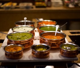 Obraz na płótnie Canvas Assorted Indian chutneys on table ready to eat