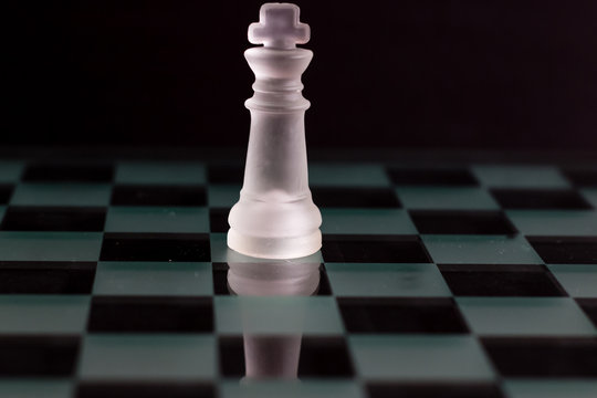 Chess Queen Beats King Between Other Pieces On The Chessboard