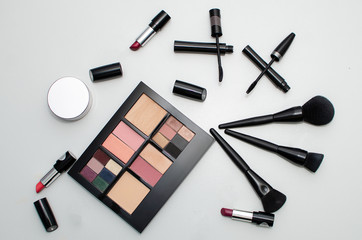 black mascara for eyes, stairs, lipstick, eyeshadow Palette, Makeup Brush, isolated on white background