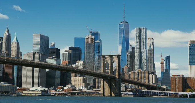 Brooklyn bridge during sunset over Manhattan with Cityscape of New York, USA. 4K time lapse