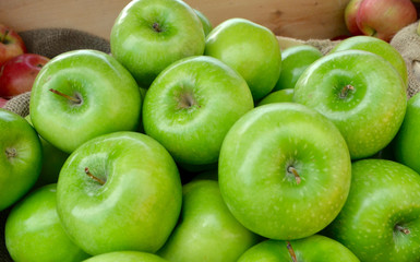 Granny Smith apples grown in the Hudson Valley of New York State for sale at a local farm stand. Closeup.