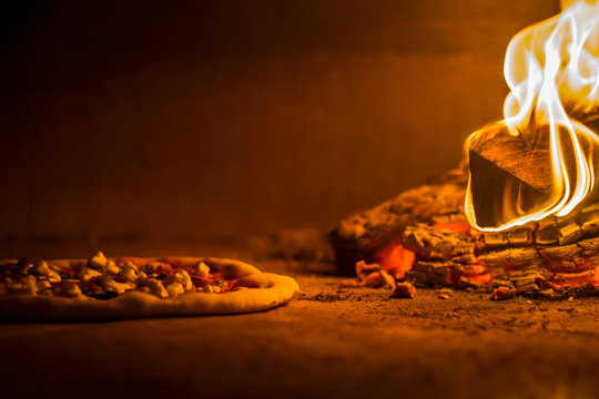 Pizza on wood burning fire oven 