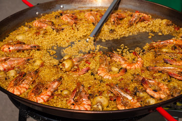 Cooking Spanish Seafood Paella in Traditional Pan