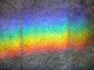 Bright rainbow on cracked tiles