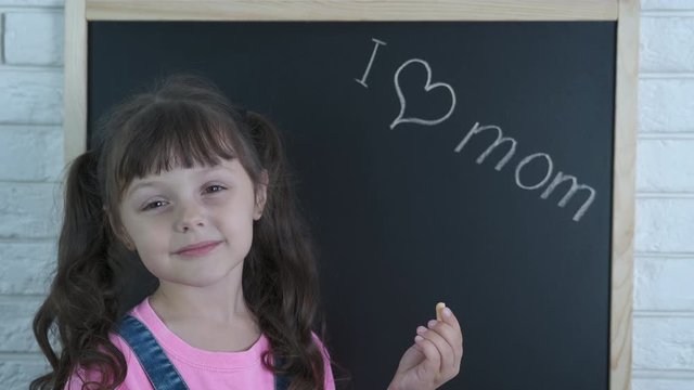 A Child Confesses To Her Mother Love. The Little Girl Confesses Her Love To Her Mother.