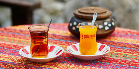 Turkish orange and black tea in traditional glasses