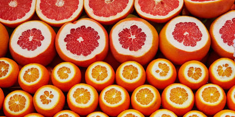 Many cut juicy oranges and grapefruits on a market in Istanbul, Turkey