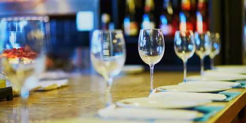 Row of wine glasses on the table in restaurant