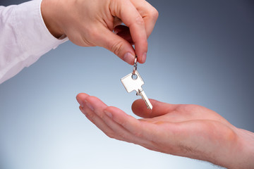 Real Estate Agent Giving Keys To Apartment Owner