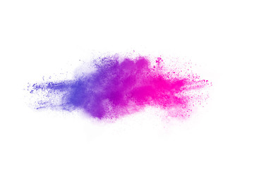 Fototapeta premium Freeze motion of purple color powder exploding on white background.