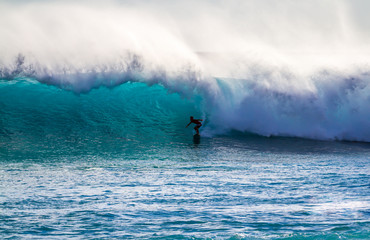 Surfing a wave in Hawaii