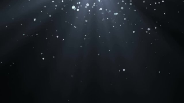Abstract white snow bokeh on black background. Christmas footage.
