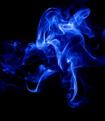 Blue smoke on black background