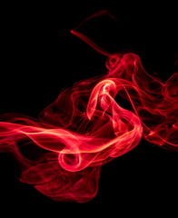 Red smoke on black background