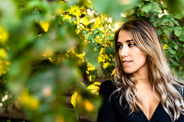Close-up of a beautiful young woman posing candid biting her lip.