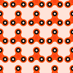 Fidget spinner. Hand toy for stress relief. Seamless pattern with orange spinners for wrapping paper, wallpaper, web page background and more. Vector illustration. EPS10.