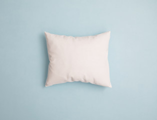 White pillow on the colored background