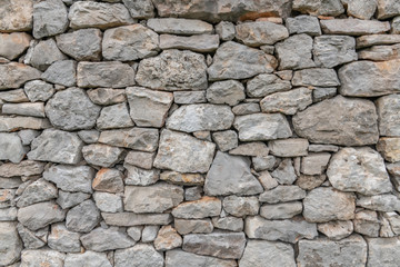 Fototapeta Stone wall texture background - grey stone siding with different sized stones  obraz