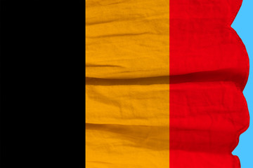 Obraz premium photograph of the beautiful colored national flag of the modern state of Germany on textured fabric, concept of tourism, economics and politics