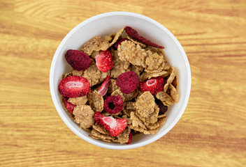 Bowl of cereals with berries from above