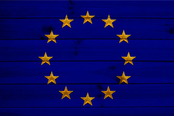 close-up photo of beautiful colored stylized European Union flag, symbol of united Europe on textured fabric, concept of tourism, emigration, economy and politics, close-up