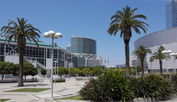 Wide shot of the Los Angeles Convention Center with palms and blue sky. Photo taken in Los Angeles, CA / USA on April 28, 2019.