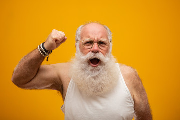 Old man with a long white beard cheering or happy. Winner. Won the lottery. - obrazy, fototapety, plakaty